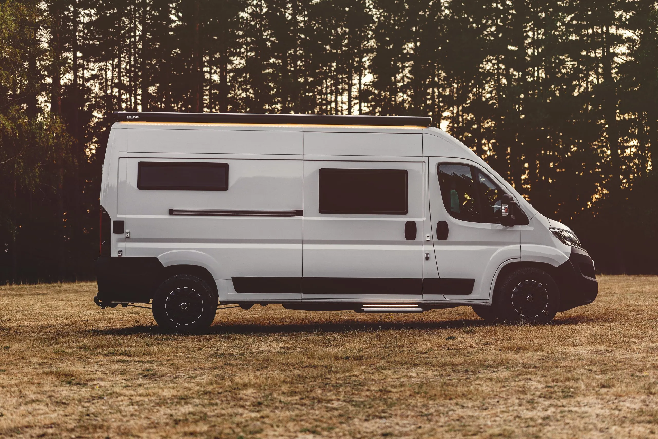The van side-on at dusk