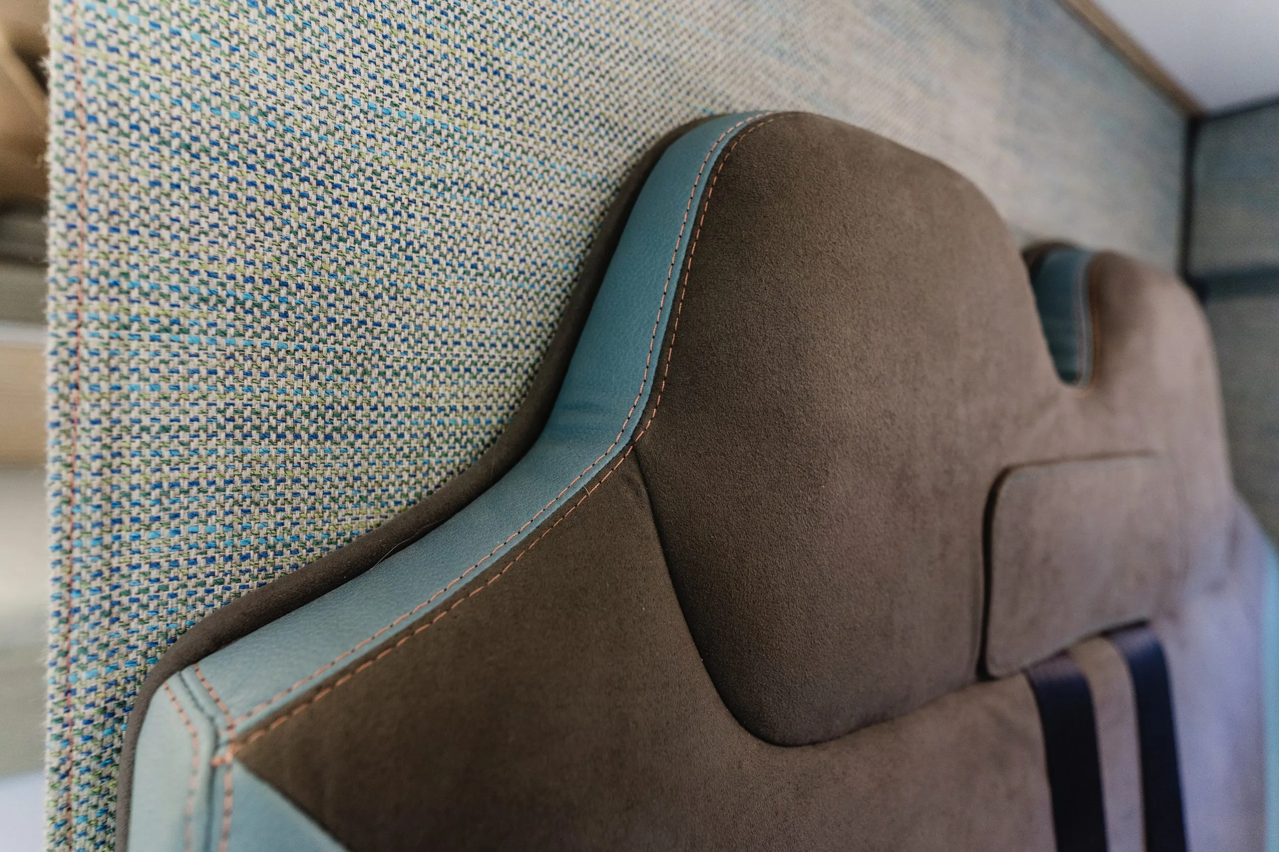 Close-up of hand-finished seat stitching